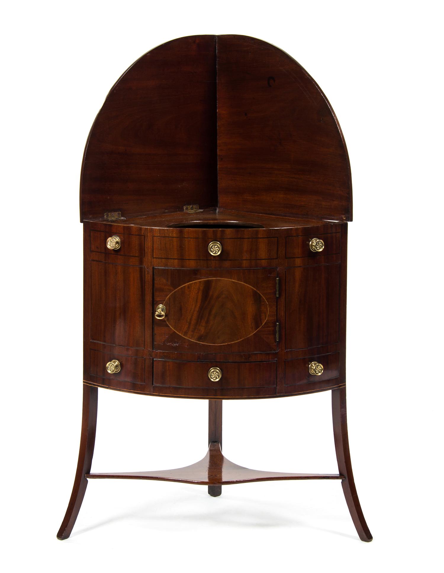 A George III Mahogany Corner Washstand, EARLY 19TH CENTURY, Height 49 x width 26 1/2 x depth 19 inches. — EARLY 19TH CENTURY,