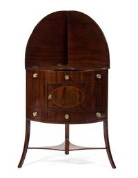 A George III Mahogany Corner Washstand, EARLY 19TH CENTURY, Height 49 x width 26 1/2 x depth 19 inches. — EARLY 19TH CENTURY,
