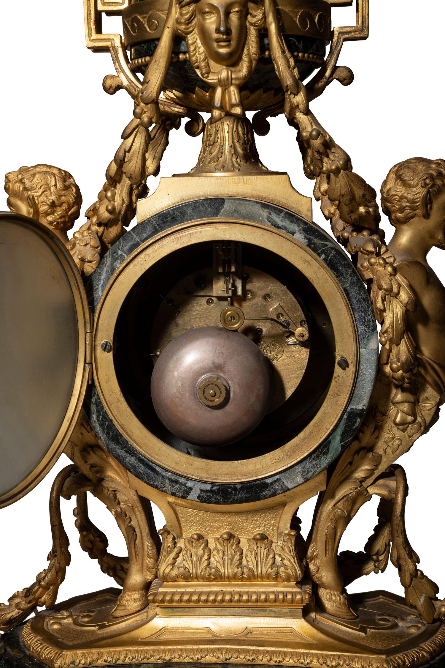 A Napoleon III Gilt Bronze and Marble Clock