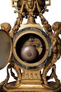 A Napoleon III Gilt Bronze and Marble Clock