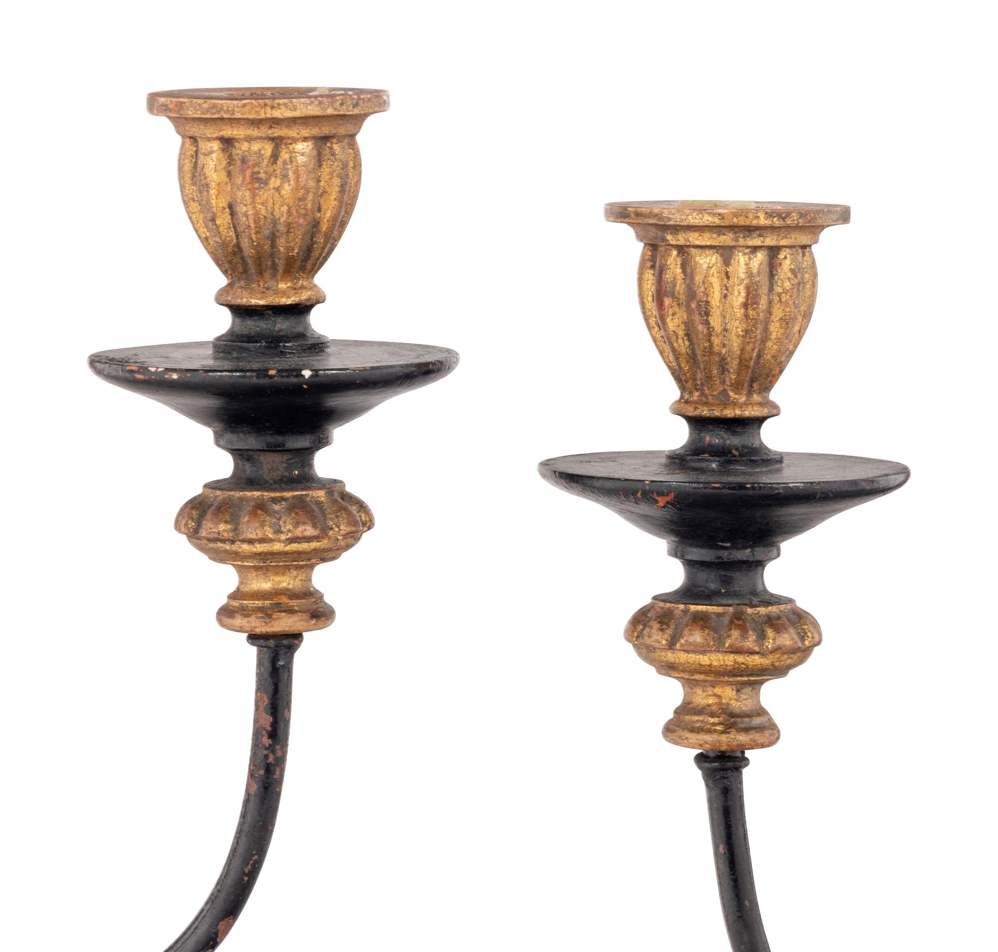A Pair of Italian Gilt and Ebonized Wood and Tôle Two-Light Sconces