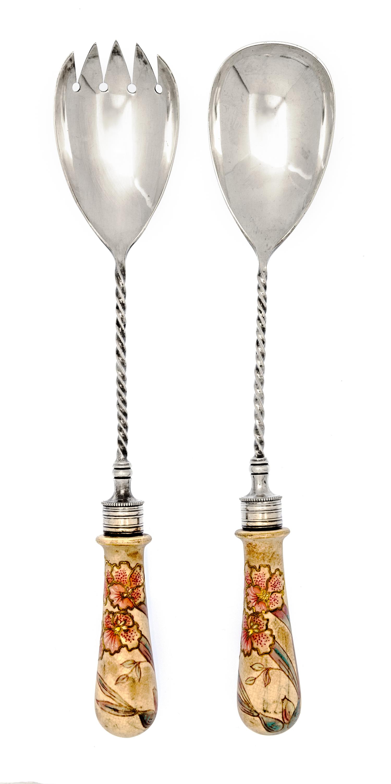 A Porcelain Mounted Silver-Plate Salad Set, 20th Century, comprising a fork and a spoon, each with floral decorated handle.