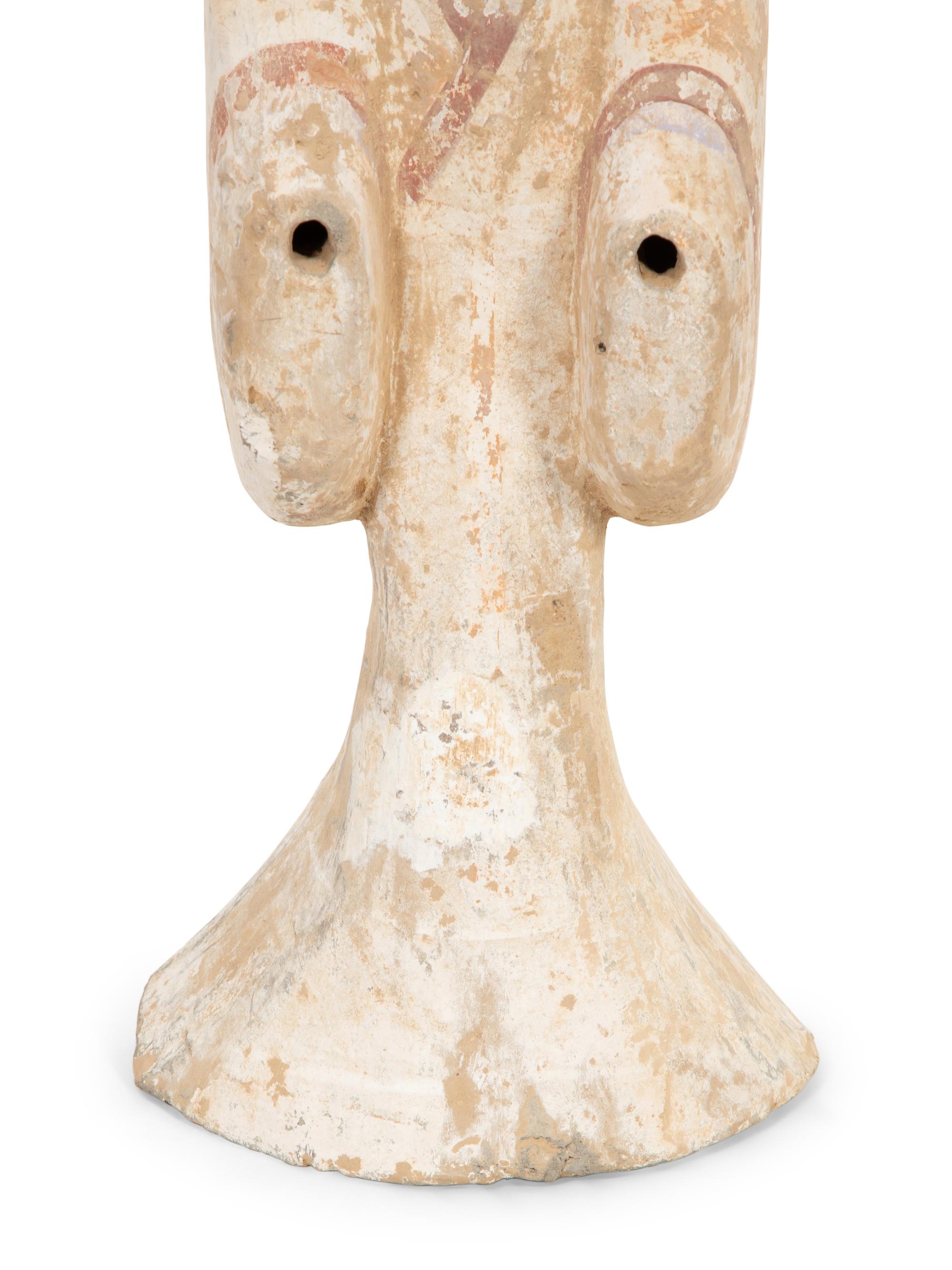 A Han Pottery Figure of a Lady