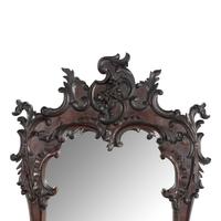 A Rococo Style Carved Walnut Mirror