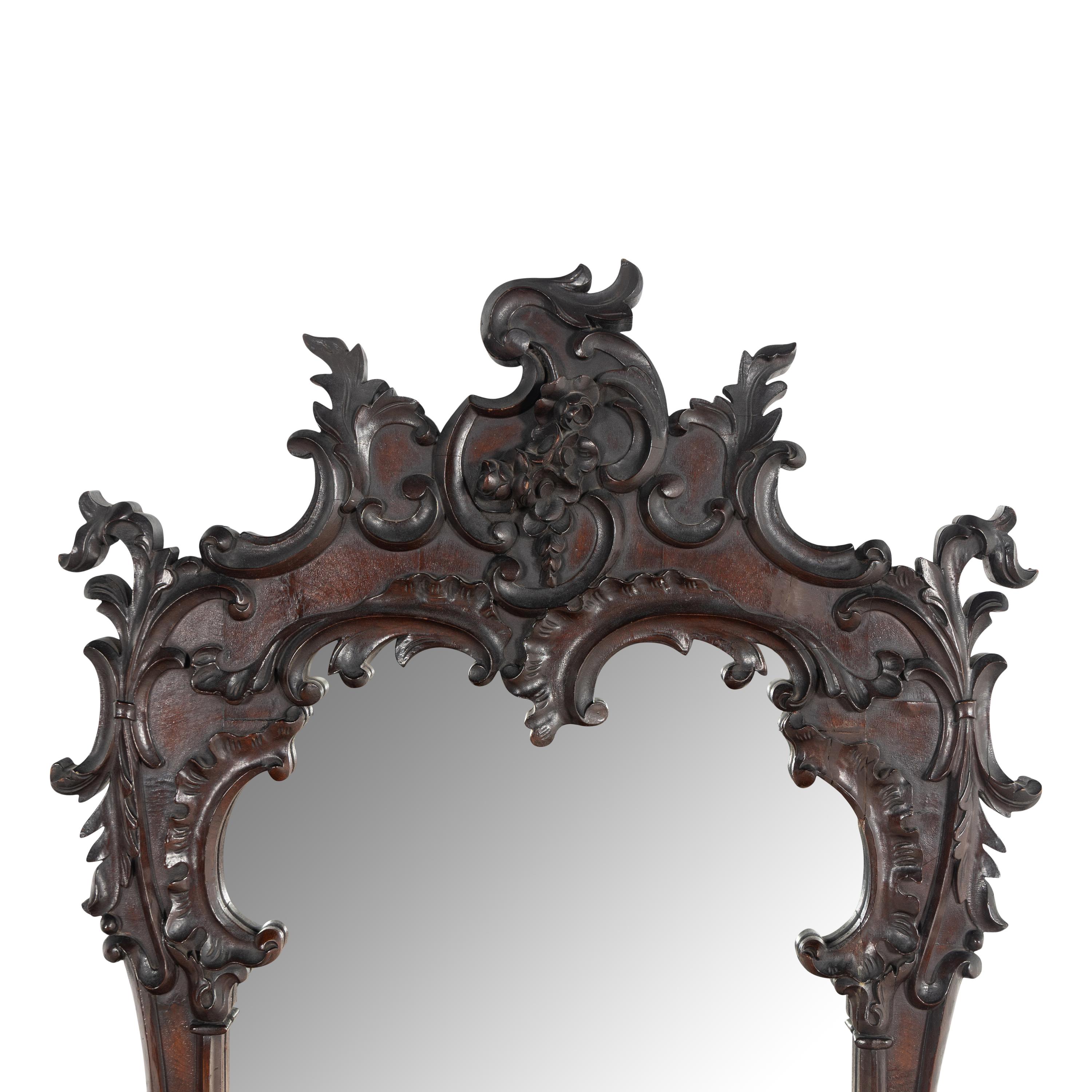 A Rococo Style Carved Walnut Mirror