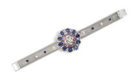 An 18 Karat White Gold, Sapphire, Ruby and Diamond Surprise Wristwatch, 39.10 dwts.
