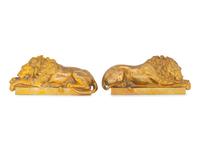 A Pair of Continental Bronze Recumbent Lions