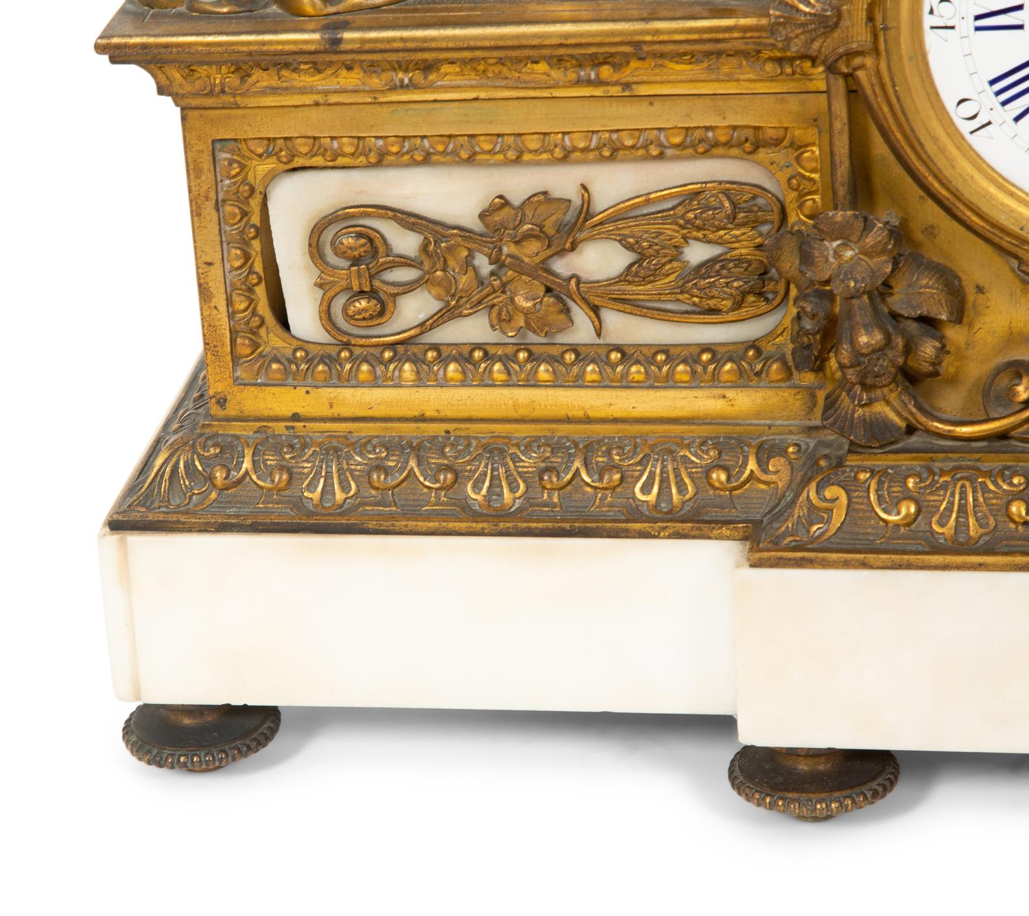 A Louis XV Style Gilt Bronze and Marble Mantel Clock
