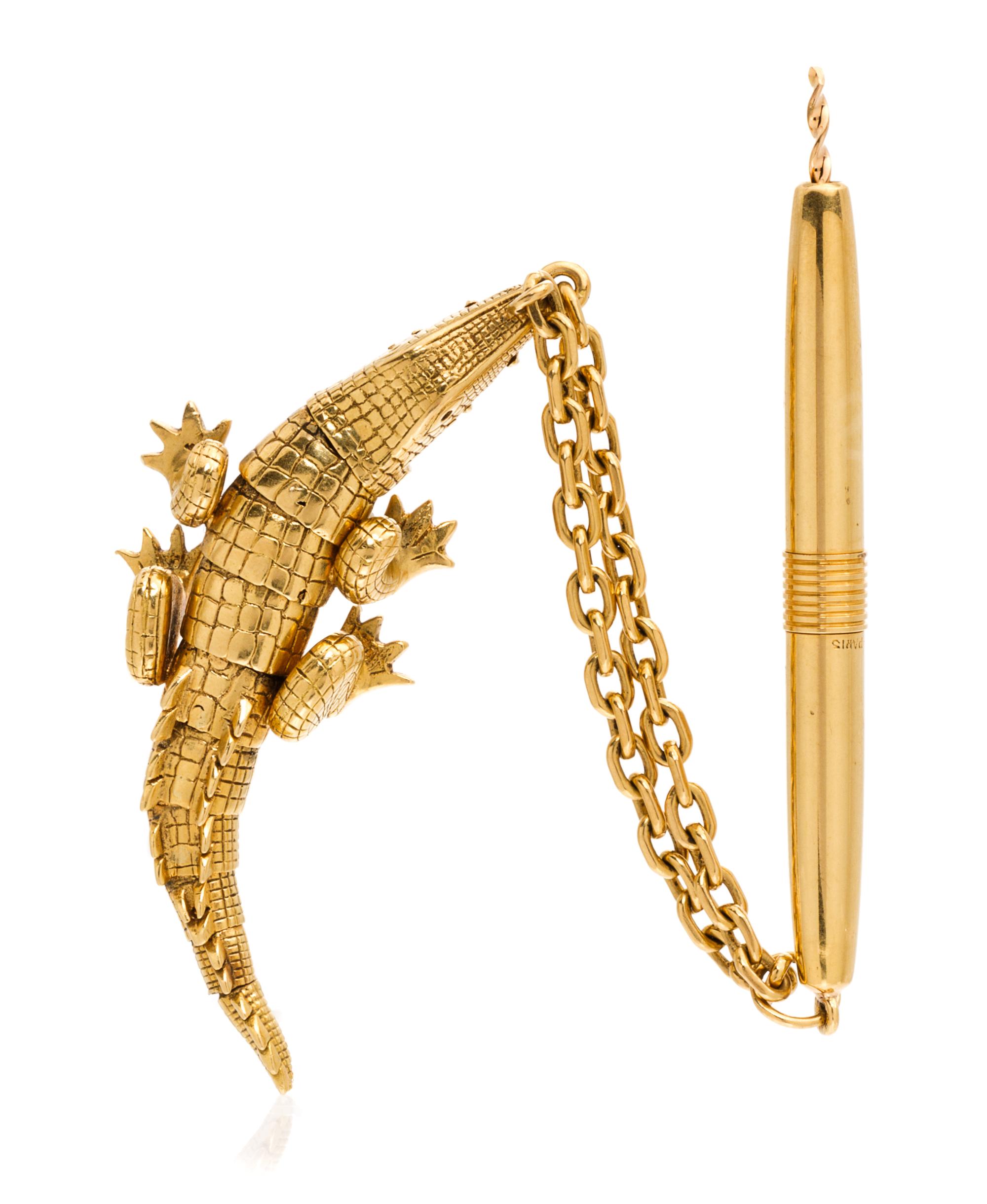 An 18 Karat Yellow Gold Alligator Fob and Cigar Draw Reamer, 20.30 dwts.
