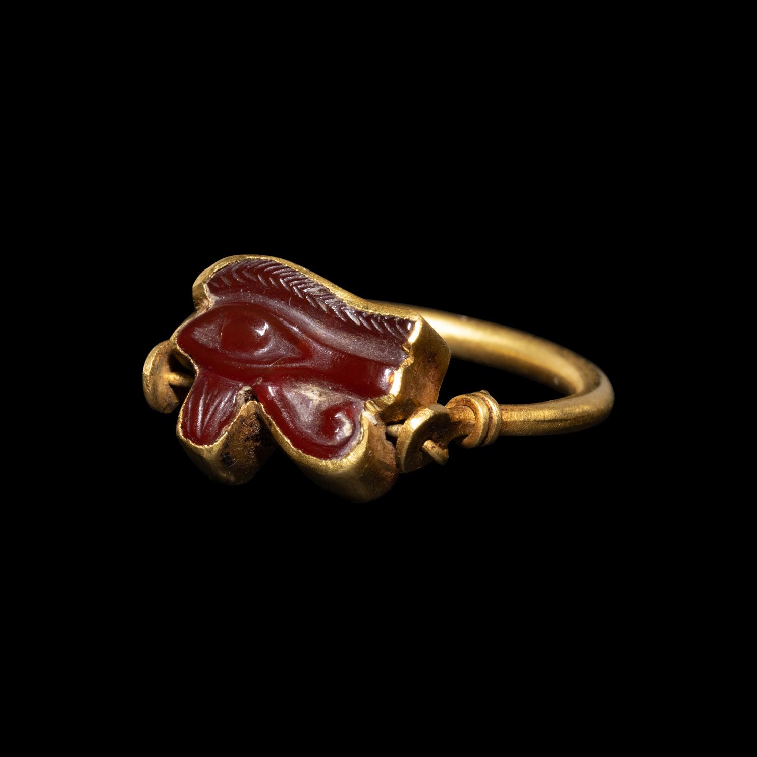 An Egyptian Carnelian Wadjet — Set in a gold swivel ring