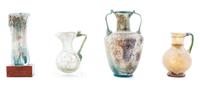 Four Roman Glass Articles Height 5 3/8 inches.