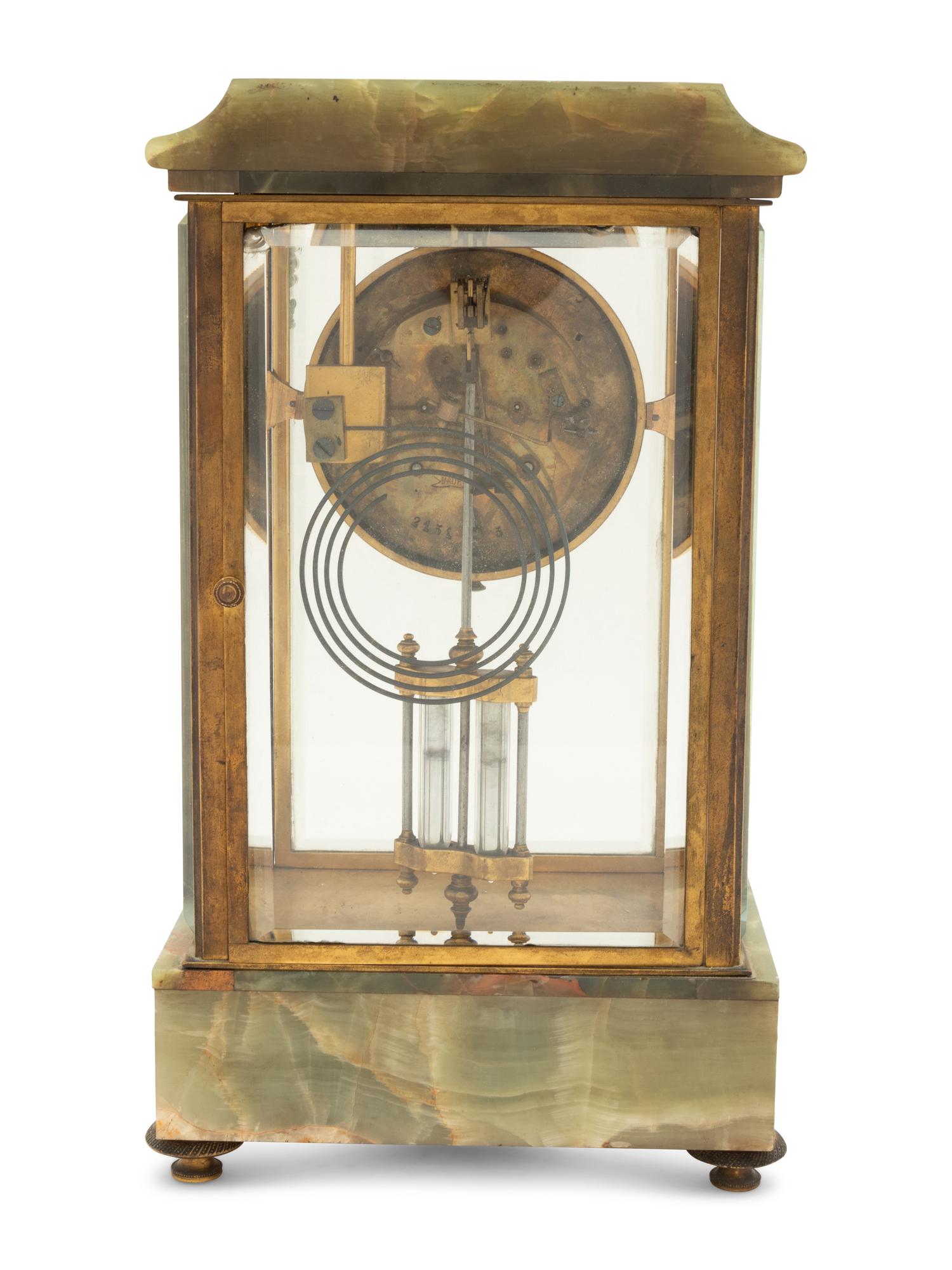 A French Parcel Gilt Bronze and Onyx Clock