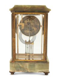 A French Parcel Gilt Bronze and Onyx Clock