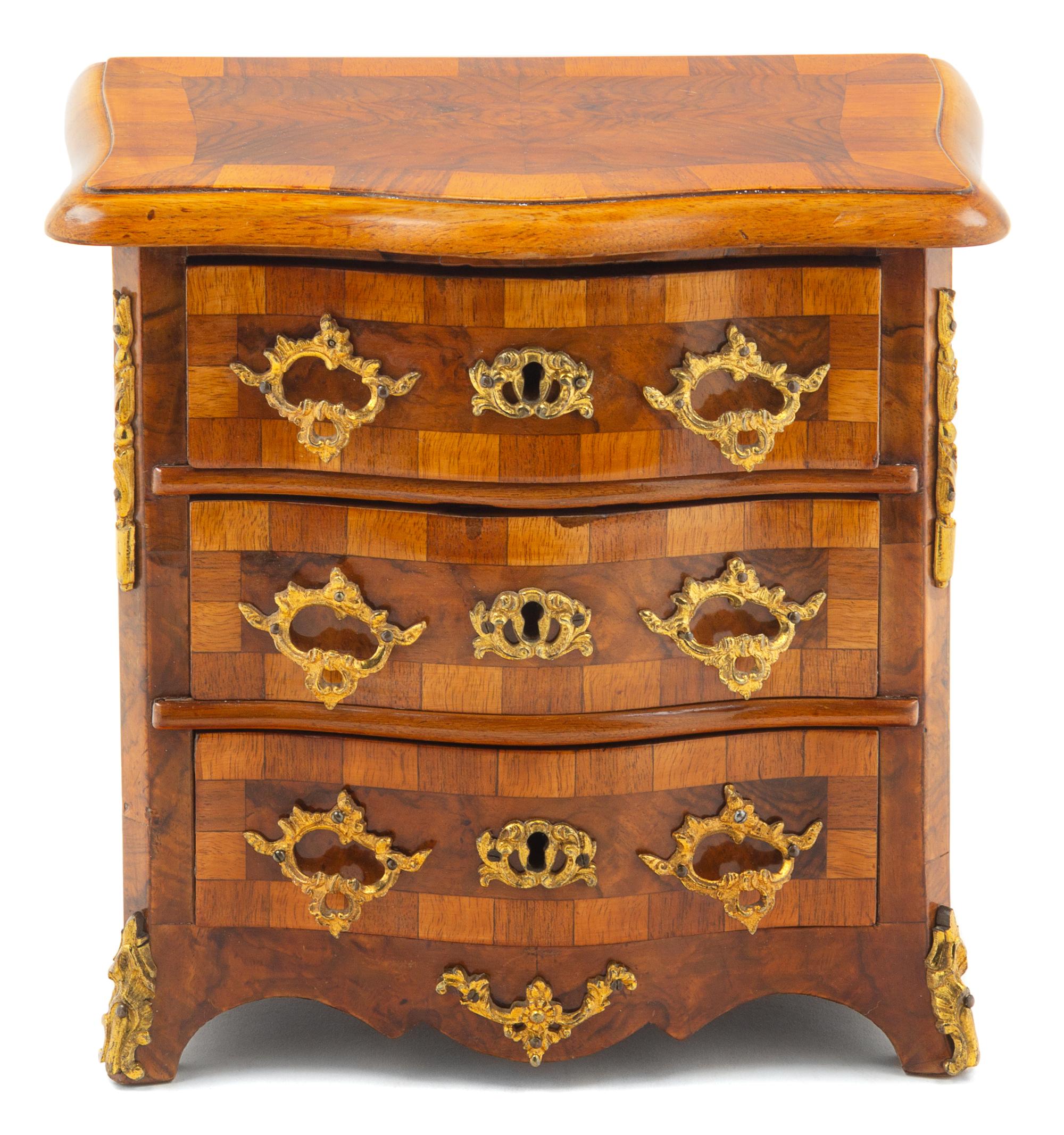 A Continental Parquetry and Gilt Metal Mounted Diminutive Commode Height 9 1/2 x width 9 1/2 x depth 6 1/2 inches. — LIKELY GERMAN OR AUSTRIAN