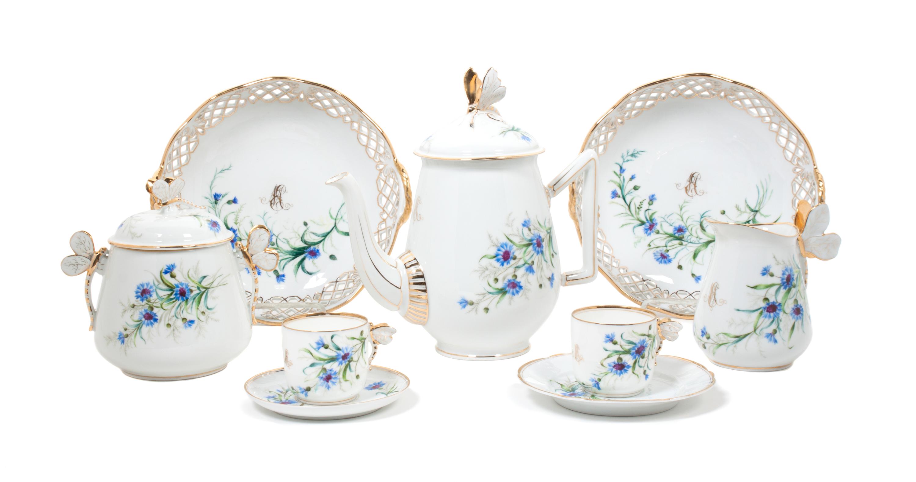 A Continental Porcelain Dessert Service Height of first 8 1/4 inches. — 20TH CENTURY