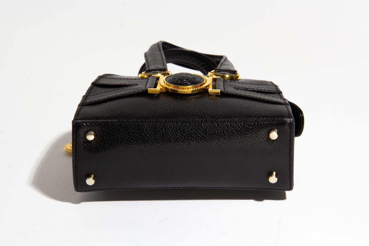 A Gianni Versace Black Leather Mini Medusa Handbag, 6.75" x 6" x 2.5"; Handle drop: 4".