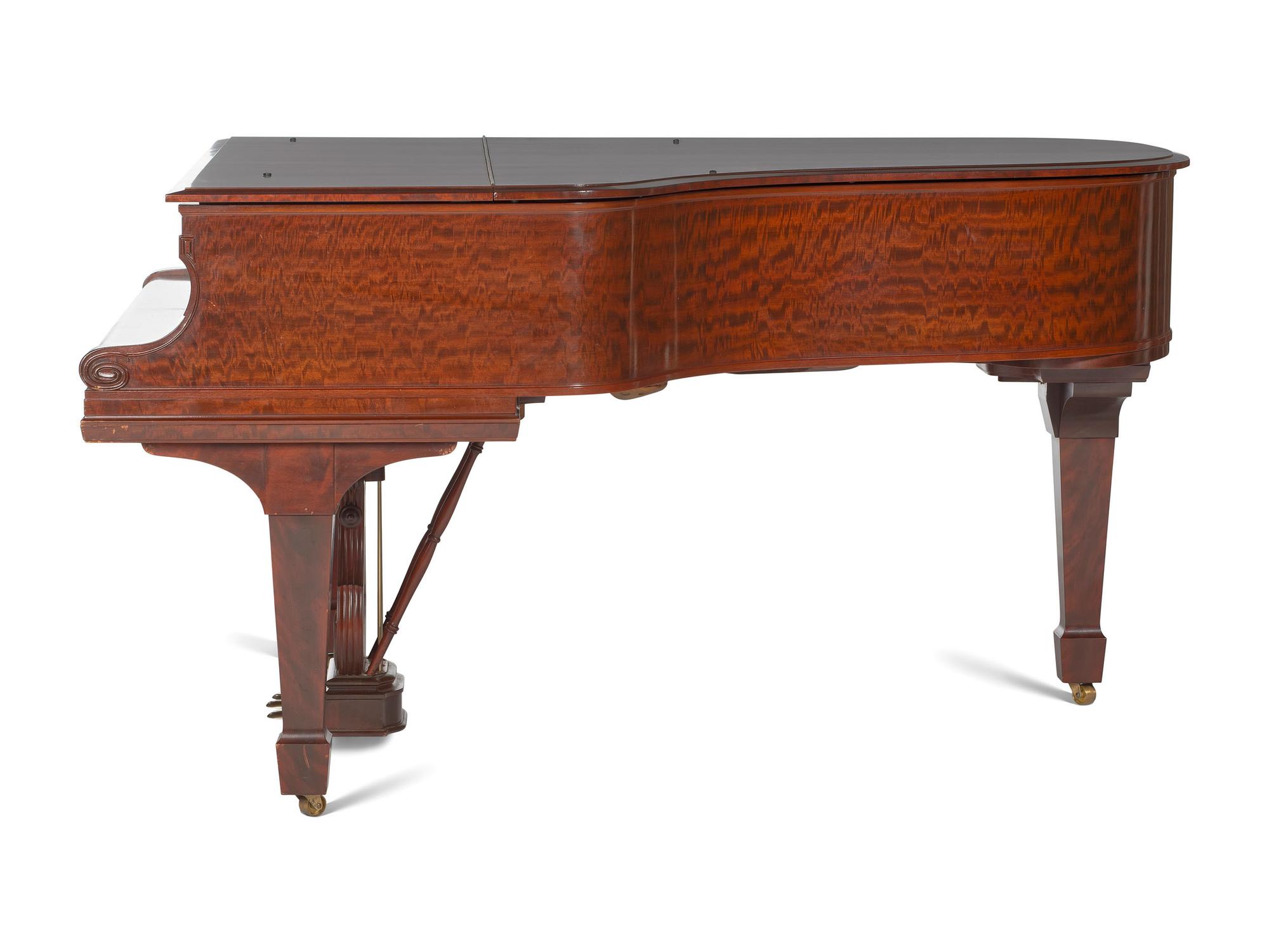 A Steinway and Sons Mahogany Baby Grand Piano