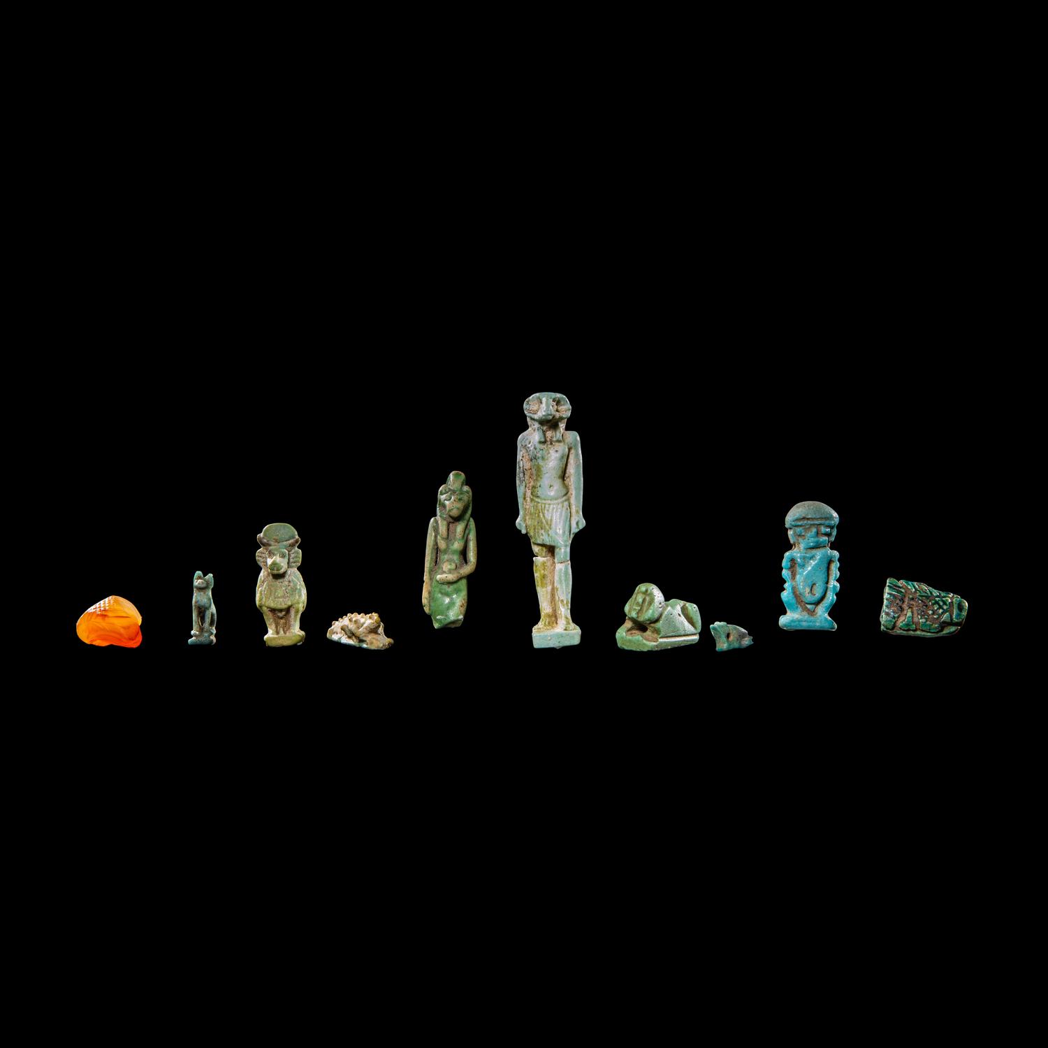Ten Egyptian Faience and Carnelian Amulets