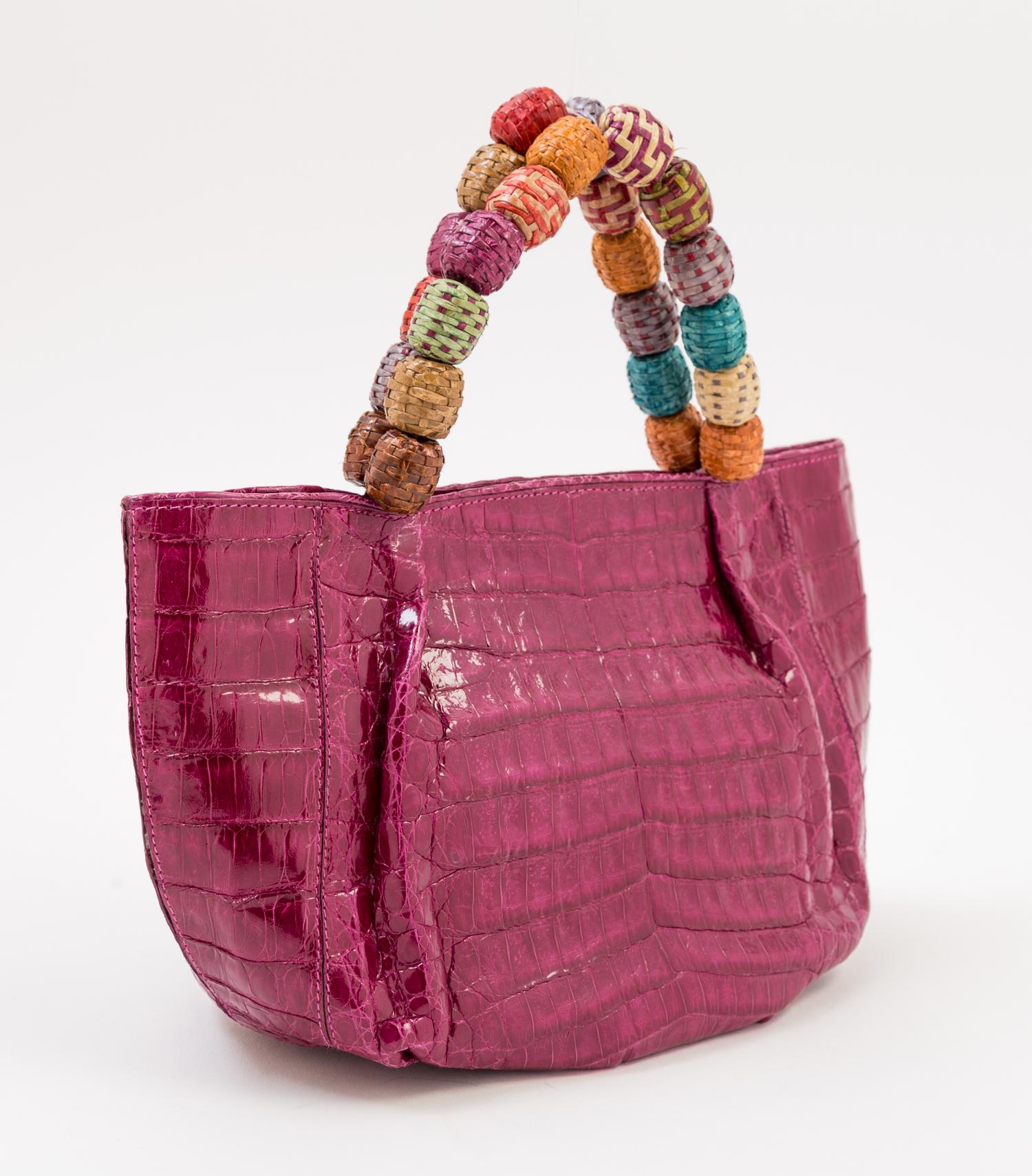 A Nancy Gonzales Fuchsia Crocodile Mini Handbag, 10.25" x 6" x 4.5." Strap drop: 3.5."