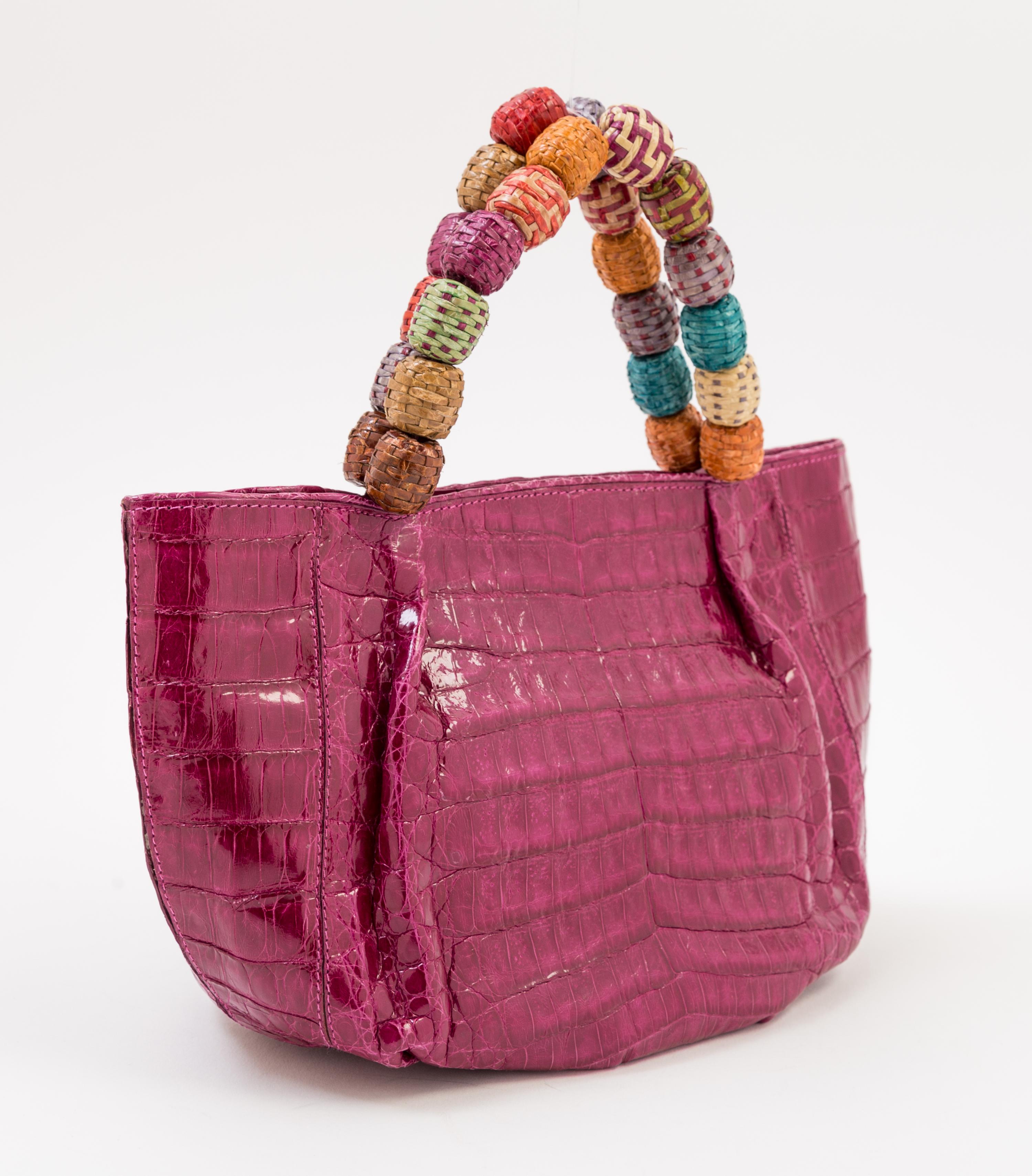 A Nancy Gonzales Fuchsia Crocodile Mini Handbag, 10.25" x 6" x 4.5." Strap drop: 3.5."