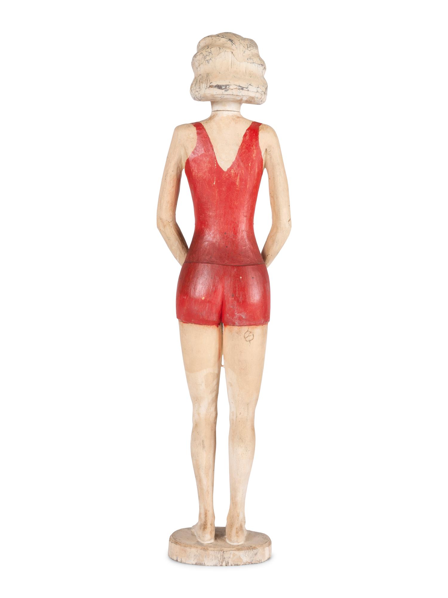 A Carved and Painted Wood Figure of a Bather
