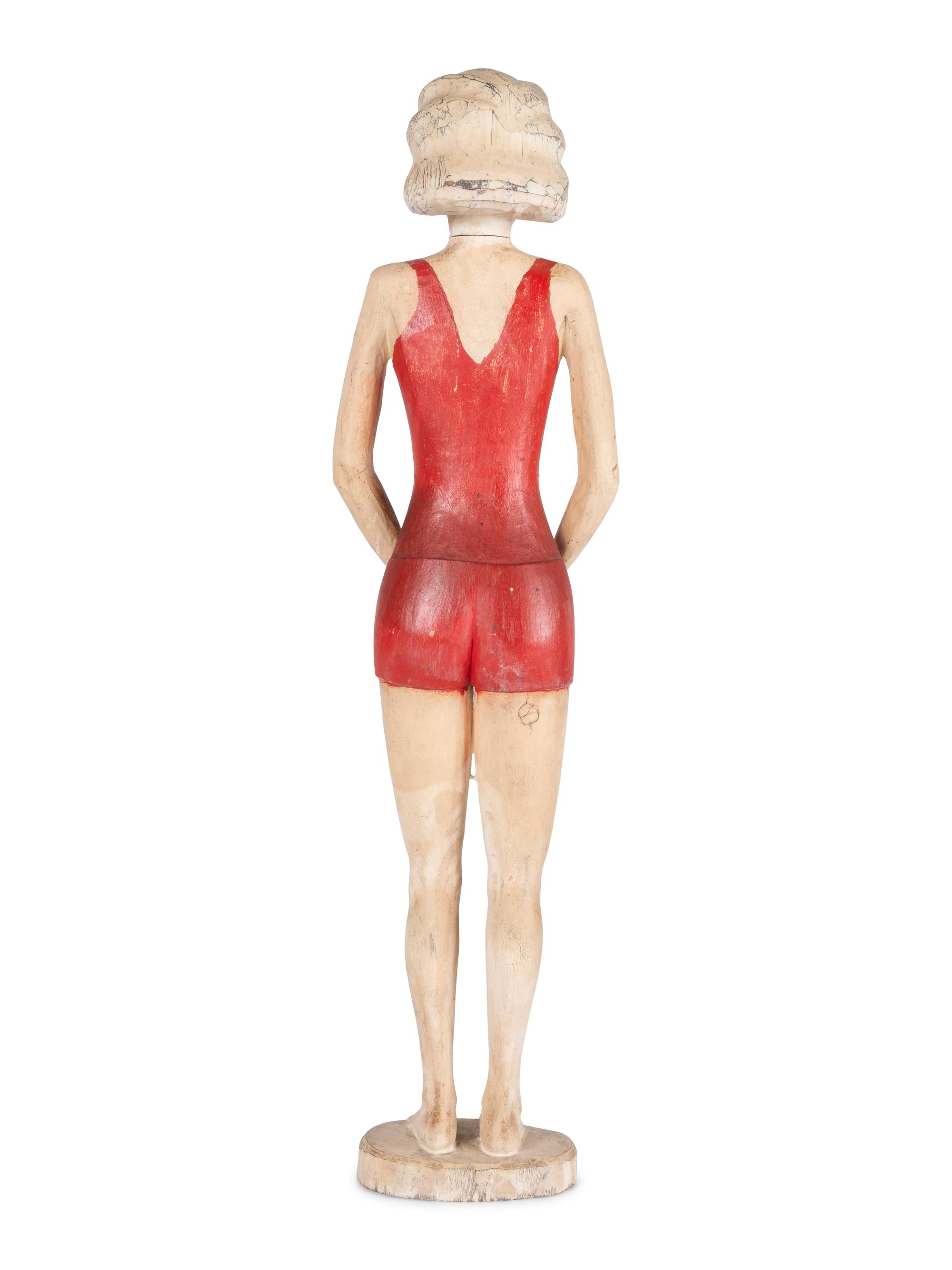 A Carved and Painted Wood Figure of a Bather