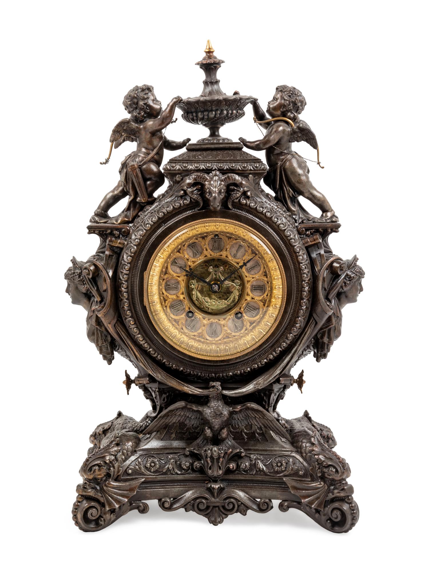 An Ansonia Lydia Patinated Metal Figural Mantel Clock