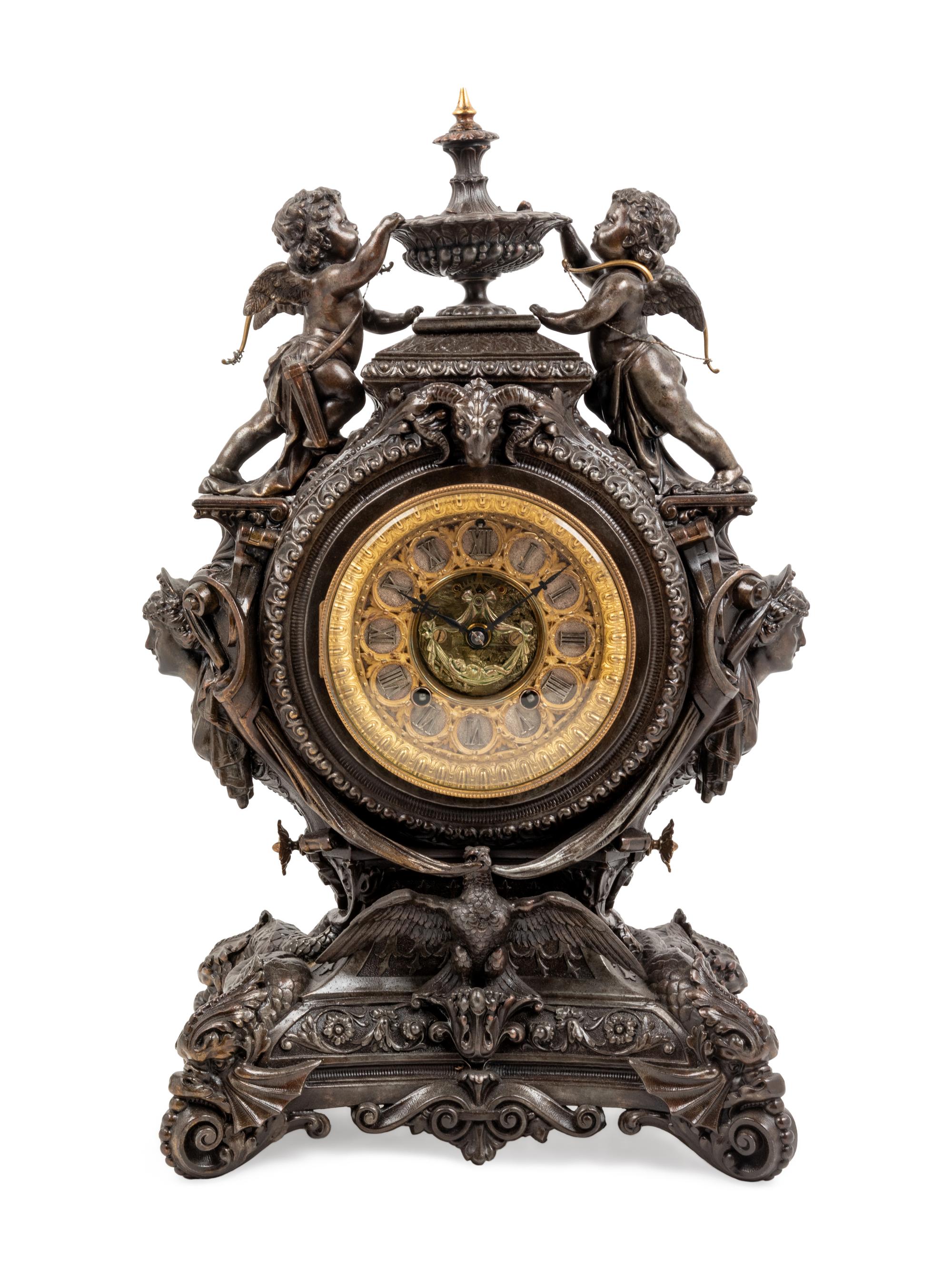 An Ansonia Lydia Patinated Metal Figural Mantel Clock