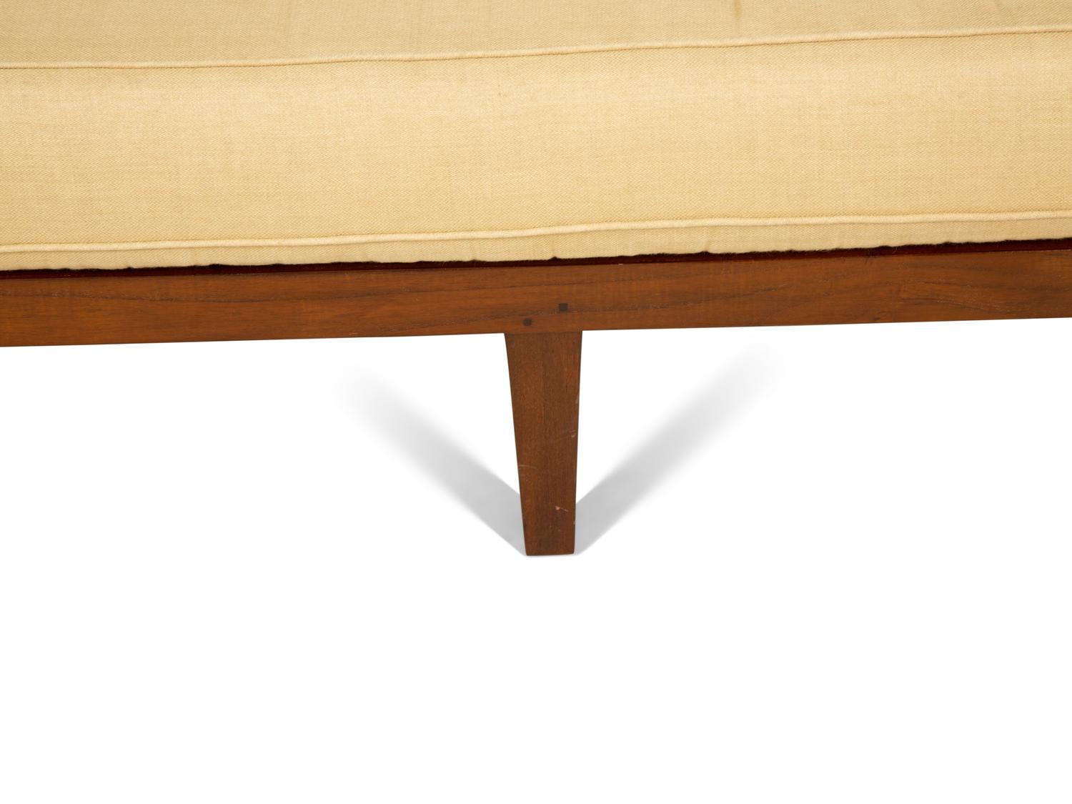 A Contemporary Walnut and Cane Daybed