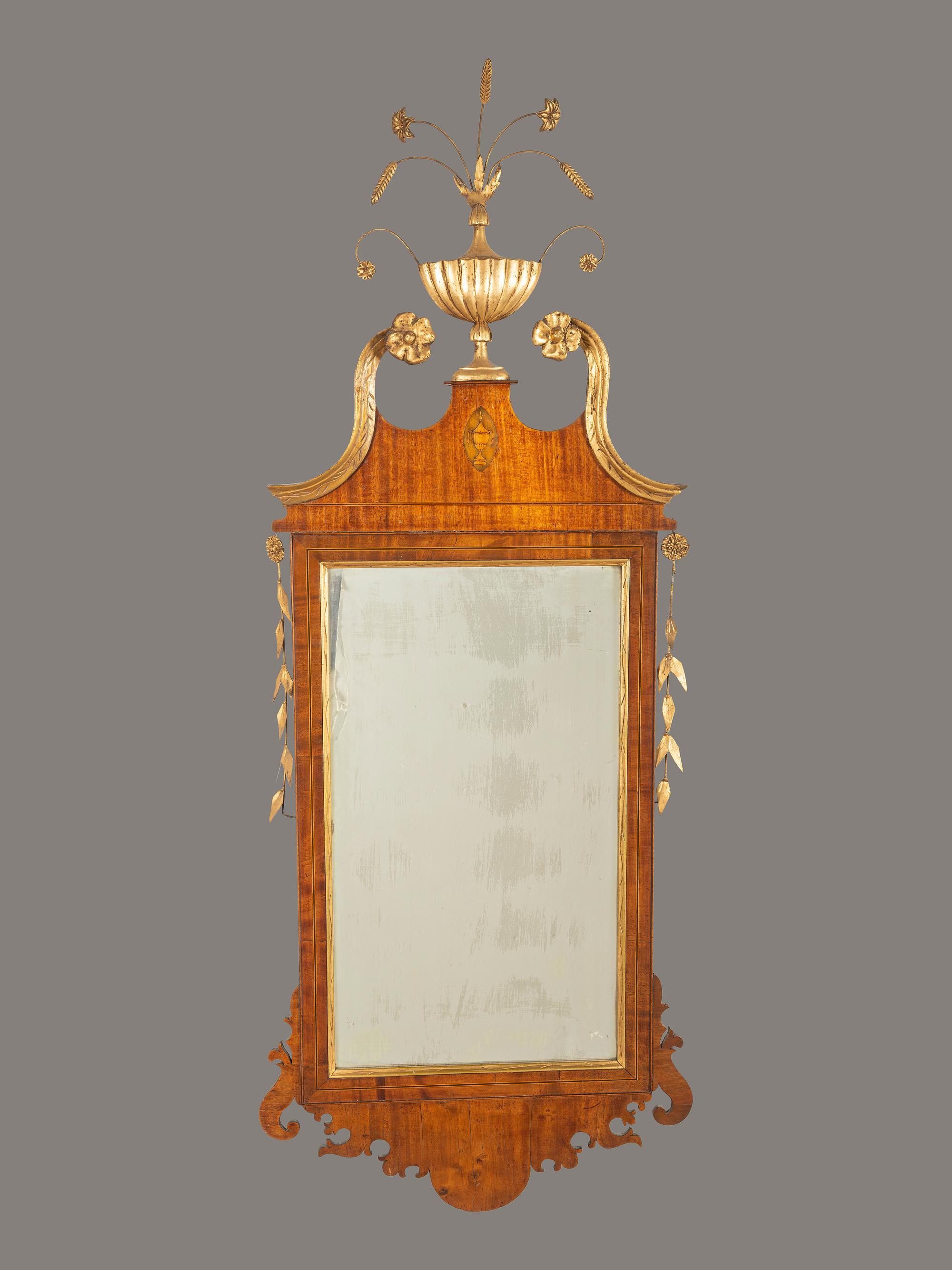 A Chippendale Parcel Gilt and Inlaid Mahogany Mirror