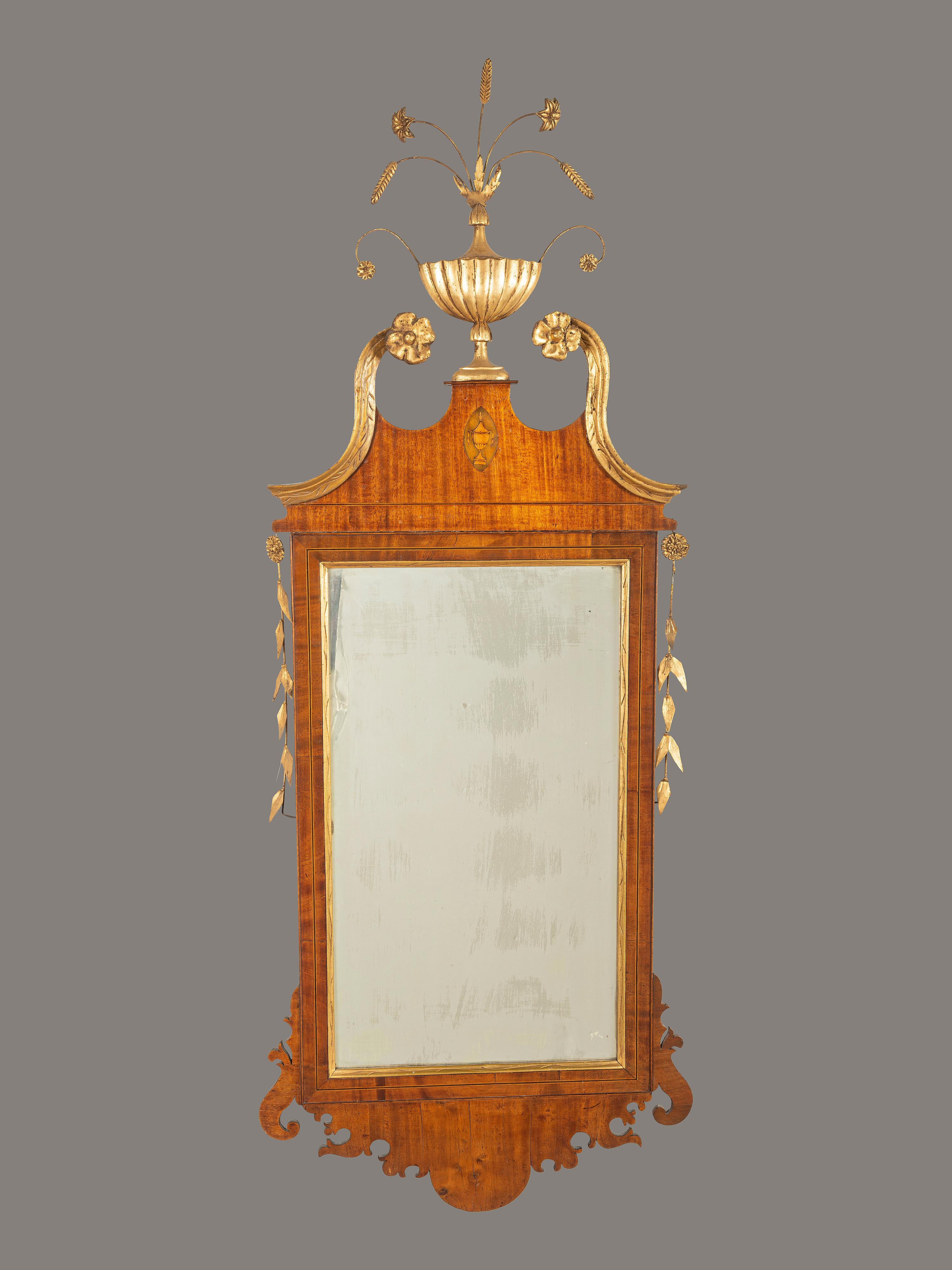 A Chippendale Parcel Gilt and Inlaid Mahogany Mirror