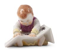 A Meissen Porcelain Baby Reading a Book, by Konrad Hentschel