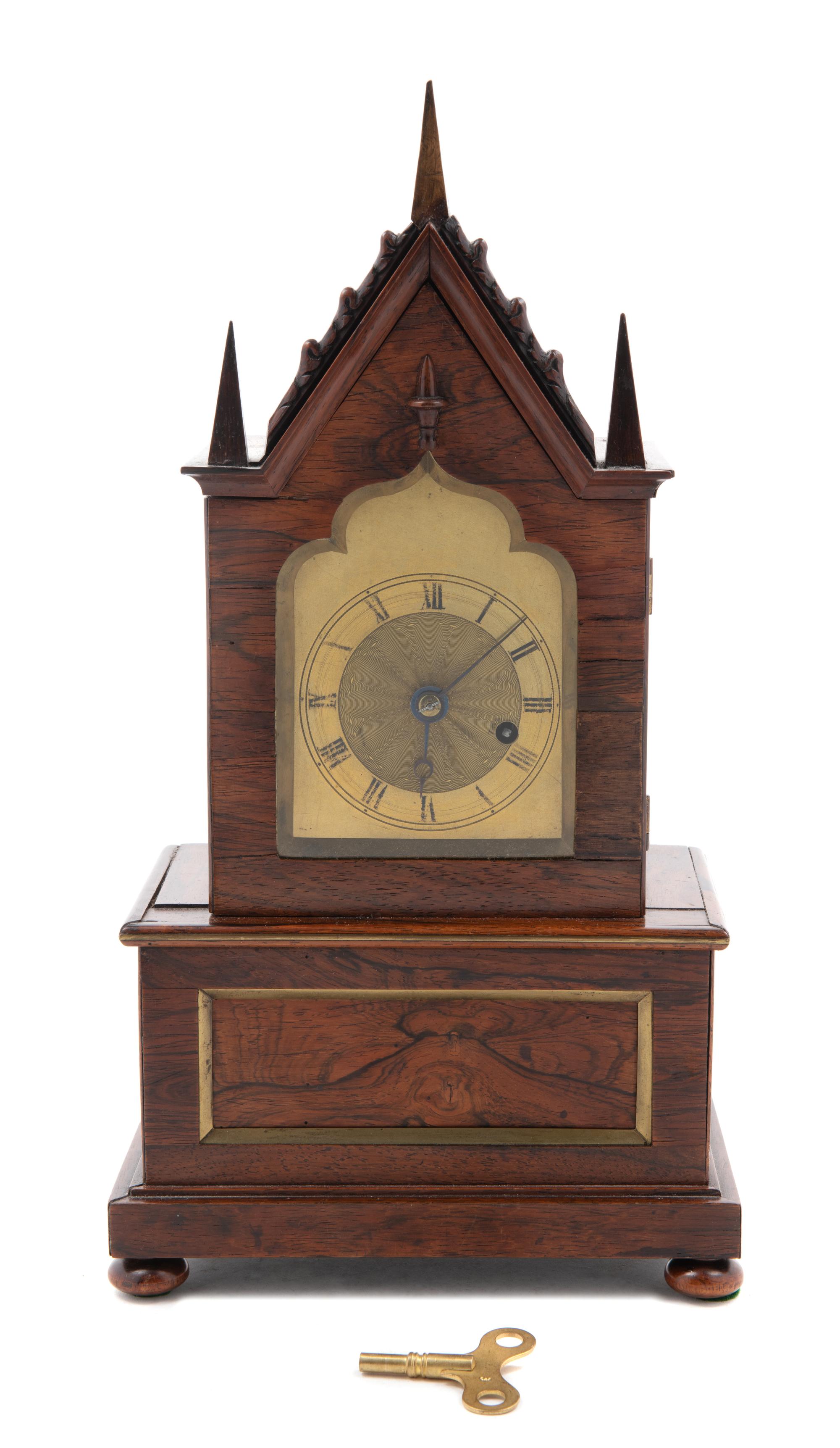 A Gothic Revival Brass Mounted Mantel Clock