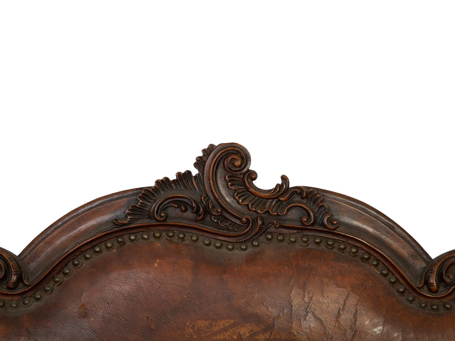 A Spanish Baroque Carved Walnut Leather-Upholstered Sofa — 17TH/18TH CENTURY