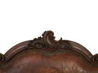 A Spanish Baroque Carved Walnut Leather-Upholstered Sofa — 17TH/18TH CENTURY