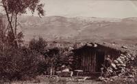 A group of three photographs (3647. Miners at Home; Untitled (main street); 2209. Dug Out - Bluer River Valley)