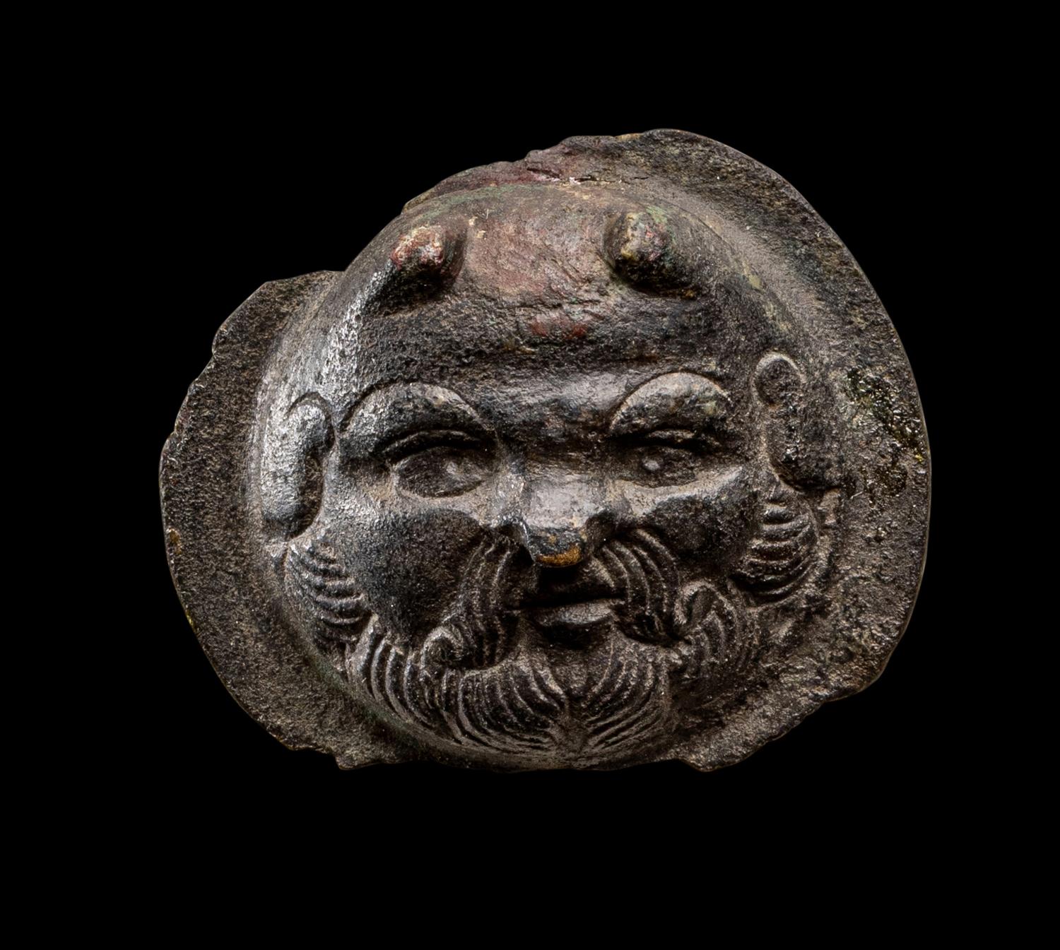 A Roman Bronze Boss with the Head of a Satyr