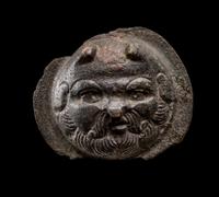 A Roman Bronze Boss with the Head of a Satyr