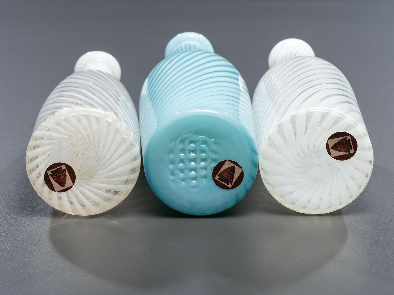 Three Opalescent Swirl Glass Barber Bottles