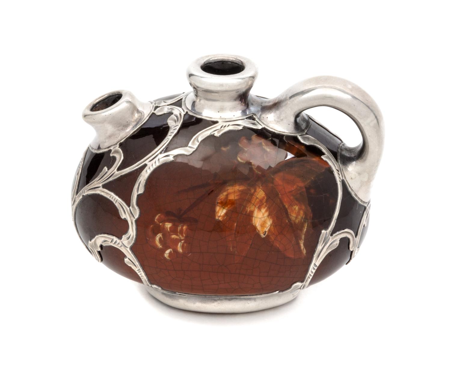 A Weller Louwelsa Silver Overlay Diminutive Pitcher Width 3 1/2 inches.