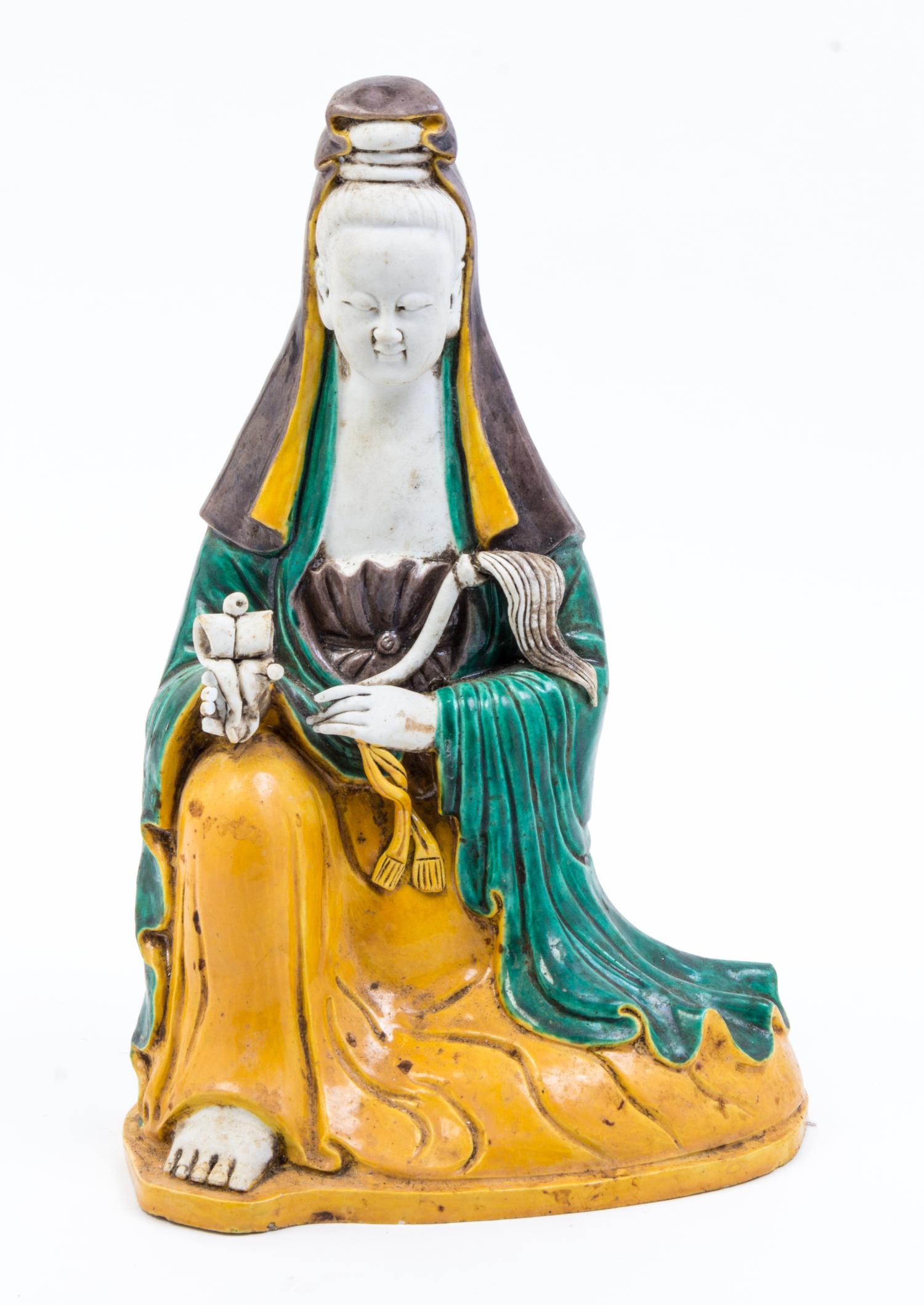 A Sancai Glazed Pottery Figure of Guanyin Height 12 1/2 inches.