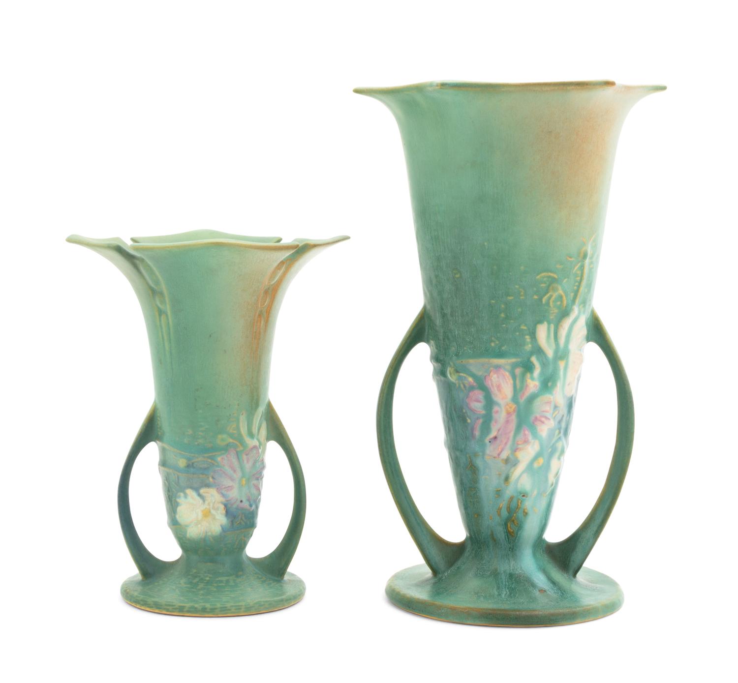 Two Roseville Cosmos Pottery Vases Height of first 10 1/4 inches, second 7 1/4 inches.