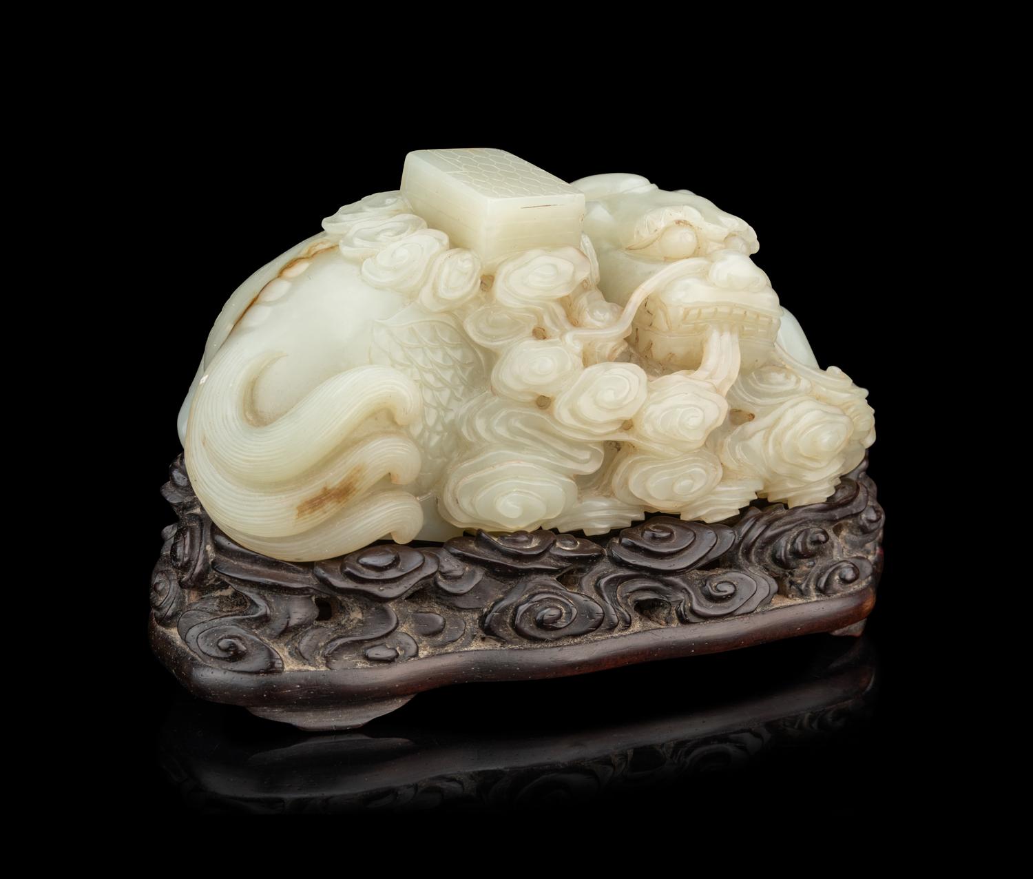 A Pale Celadon Jade 'Qilin and Book' Carving