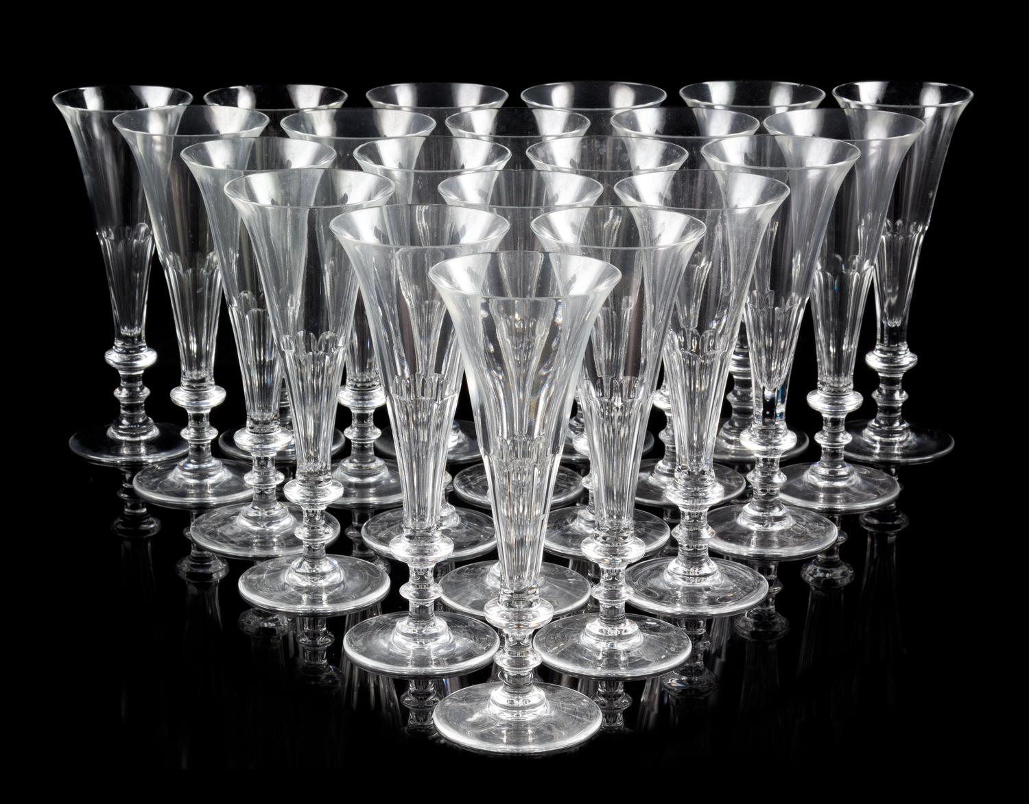 A Set of Forty-Five William Yeoward Glass Champagne Flutes Height 8 1/8 inches.