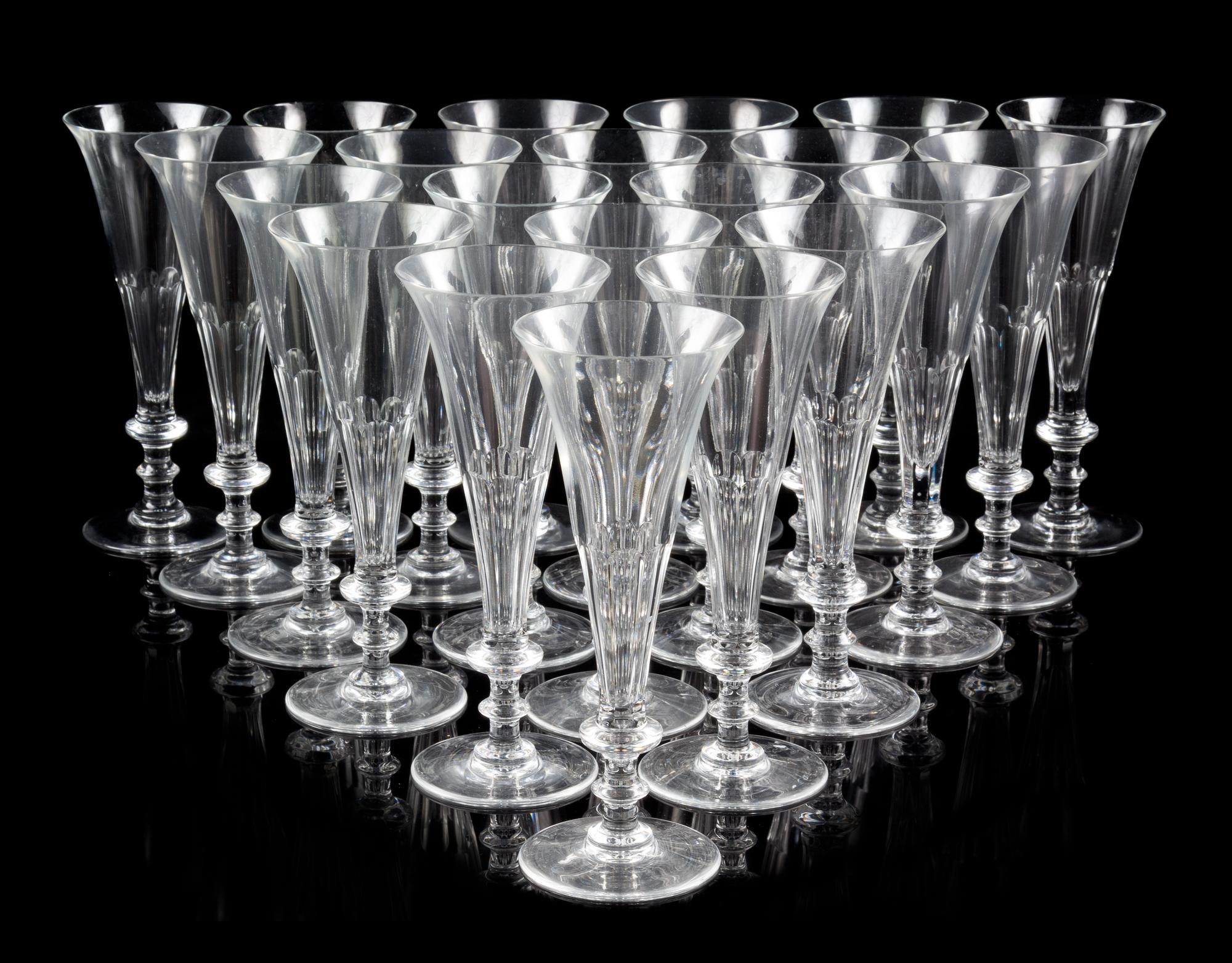 A Set of Forty-Five William Yeoward Glass Champagne Flutes Height 8 1/8 inches.