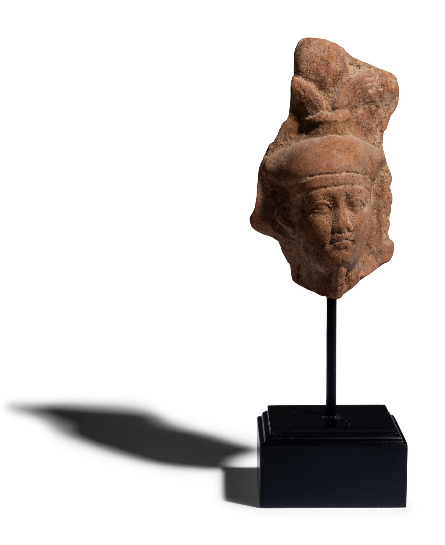 An Egyptian Terracotta Head of the God Osiris