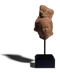 An Egyptian Terracotta Head of the God Osiris