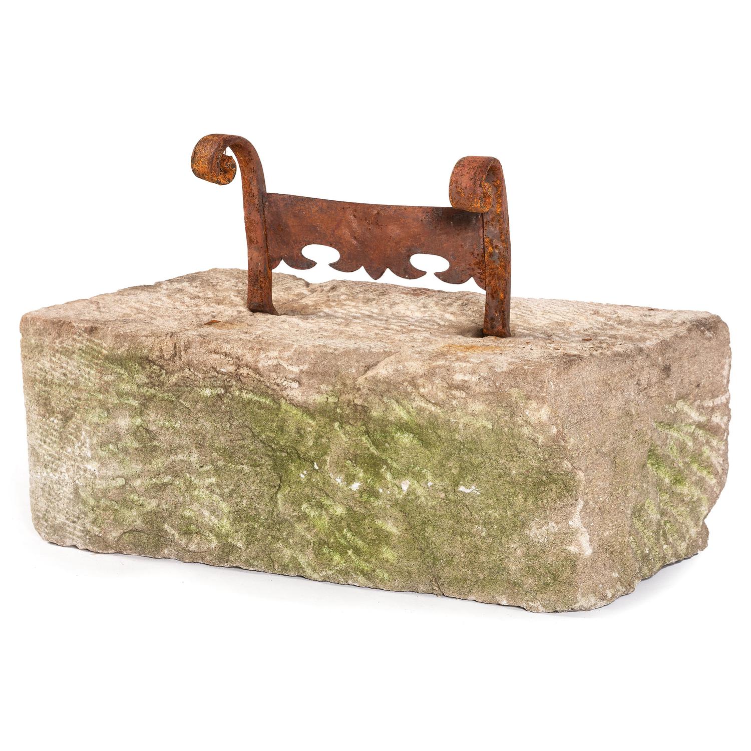 A Wrought Iron Boot Scrape with Limestone Base