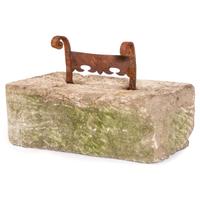A Wrought Iron Boot Scrape with Limestone Base