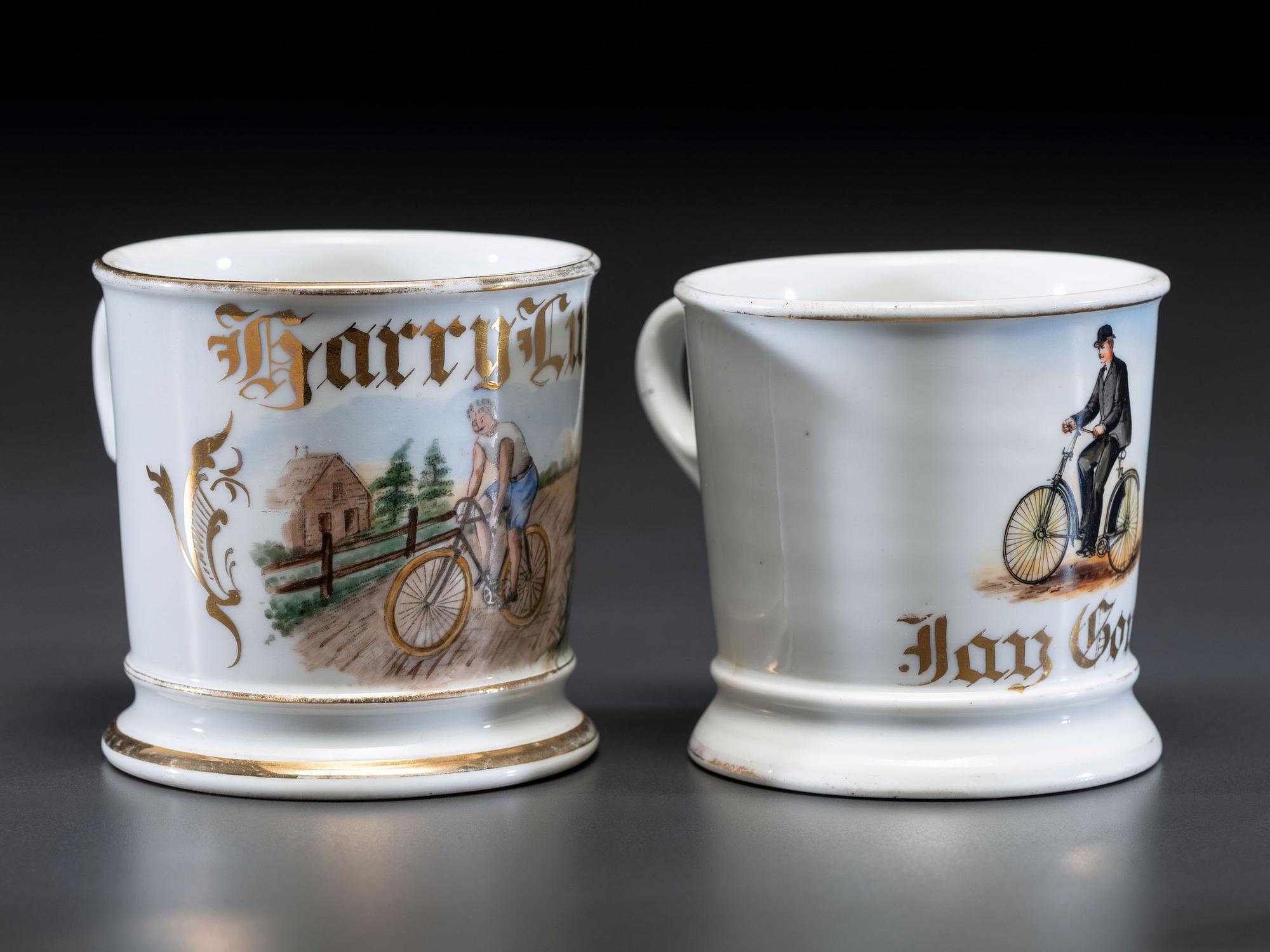 Two Cyclist's Porcelain Shaving Mugs
